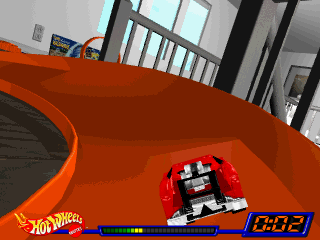 Hot Wheels Stunt Track Driver: the car rounding an orange banked curve, two seconds into the race
