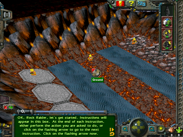 LEGO Rock Raiders: raiders on a cavern floor of lava rock and water, the tutorial’s first instruction at the foot of the screen